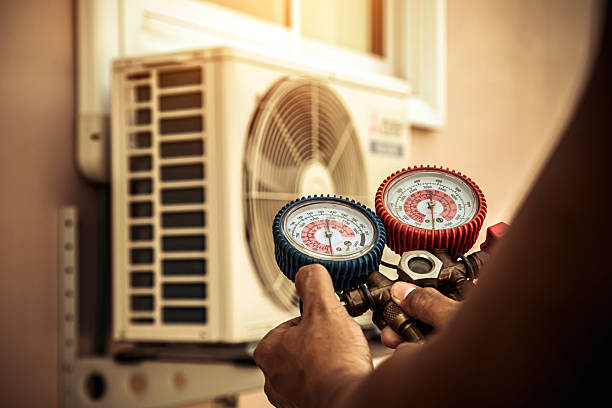 Professional Air Conditioning Service technician working in Wattsville, AL